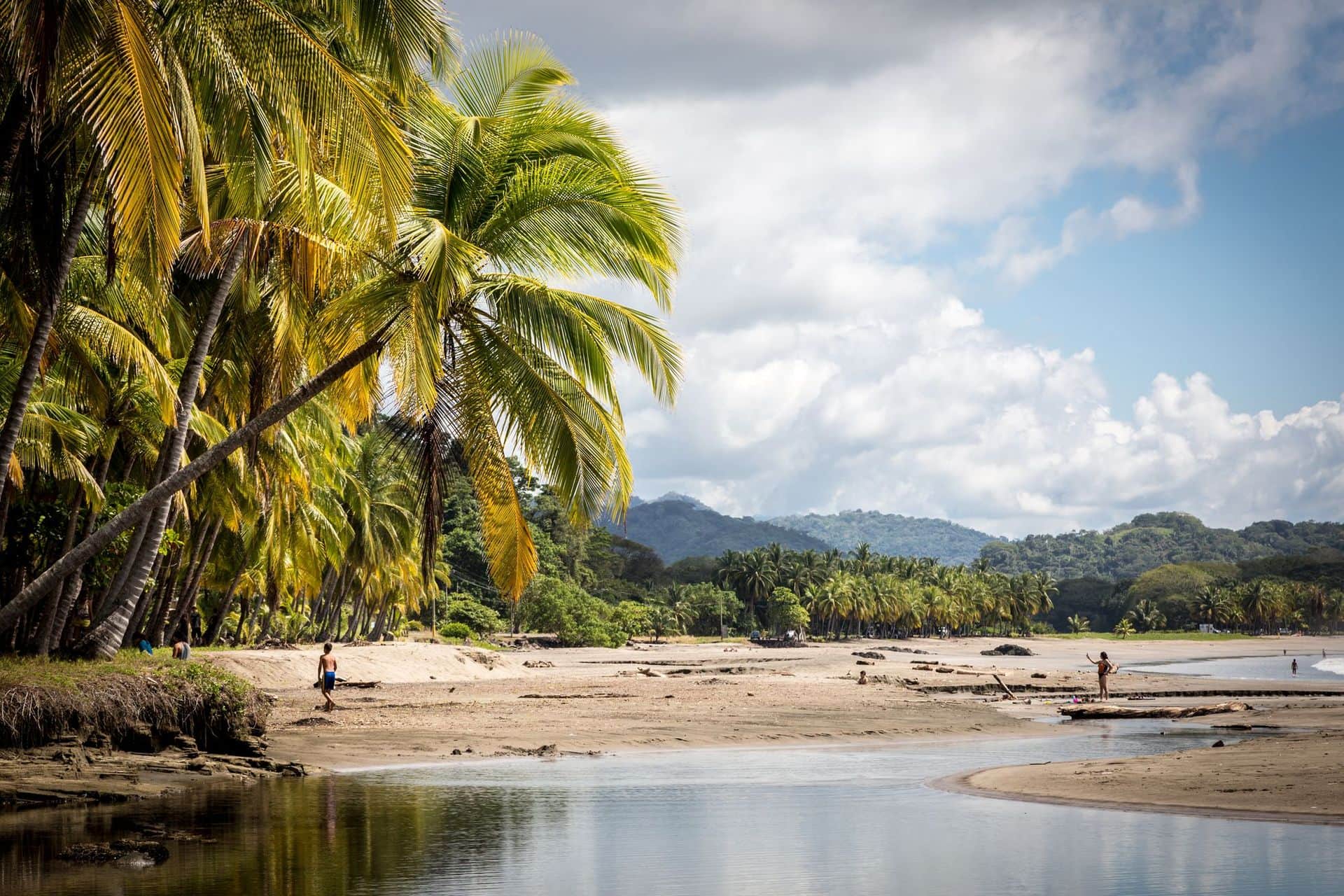Beautiful blue sky day with a blue sea and empty sand. Playa Samara, Costa Rica, Central America.
