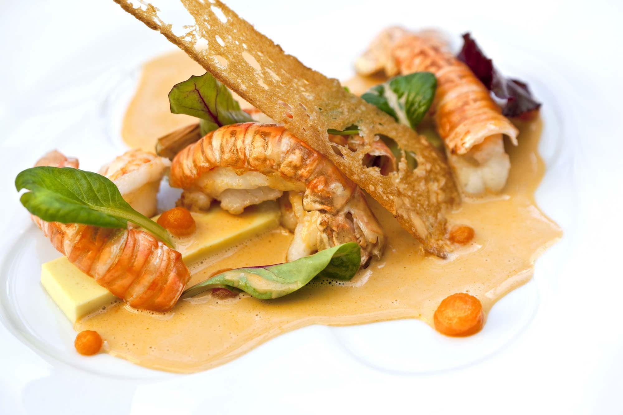 Roasted langoustines, coconut and curry jelly, lobster soup