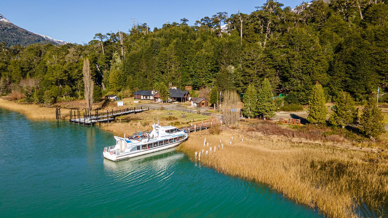 Embark on a breathtaking bus tour to Cerro Tronador, where you’ll witness the beauty of Patagonia's lakes and mountains, including Lago Gutierrez and Lago Mascardi. Named for the thunderous sounds of ice falling from its glaciers, Cerro Tronador offers stunning panoramic views of the Andes and surrounding landscapes. Along the way, you'll enjoy two short walks to scenic viewpoints with cascading waterfalls and the impressive Manso Glacier. After a relaxing lunch at Pampa Linda, the journey continues through forests offering views of the iconic three peaks of Cerro Tronador: Argentina, International, and Chile. A visit to the “Devil’s Throat” rock amphitheater and a crossing over the Manso Inferior River bridge completes this unforgettable day, before you return to Bariloche, leaving you with lasting memories of Patagonia's stunning natural wonders.