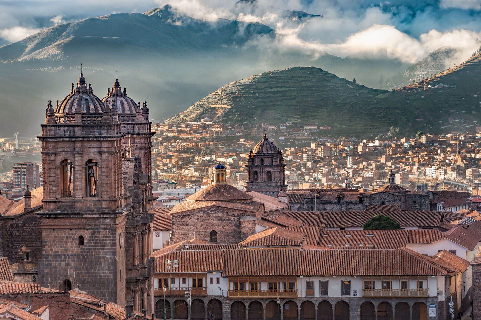 Morning sun rising with cloudy on Aden Mountain at Plaza de armas, Cusco, Peru