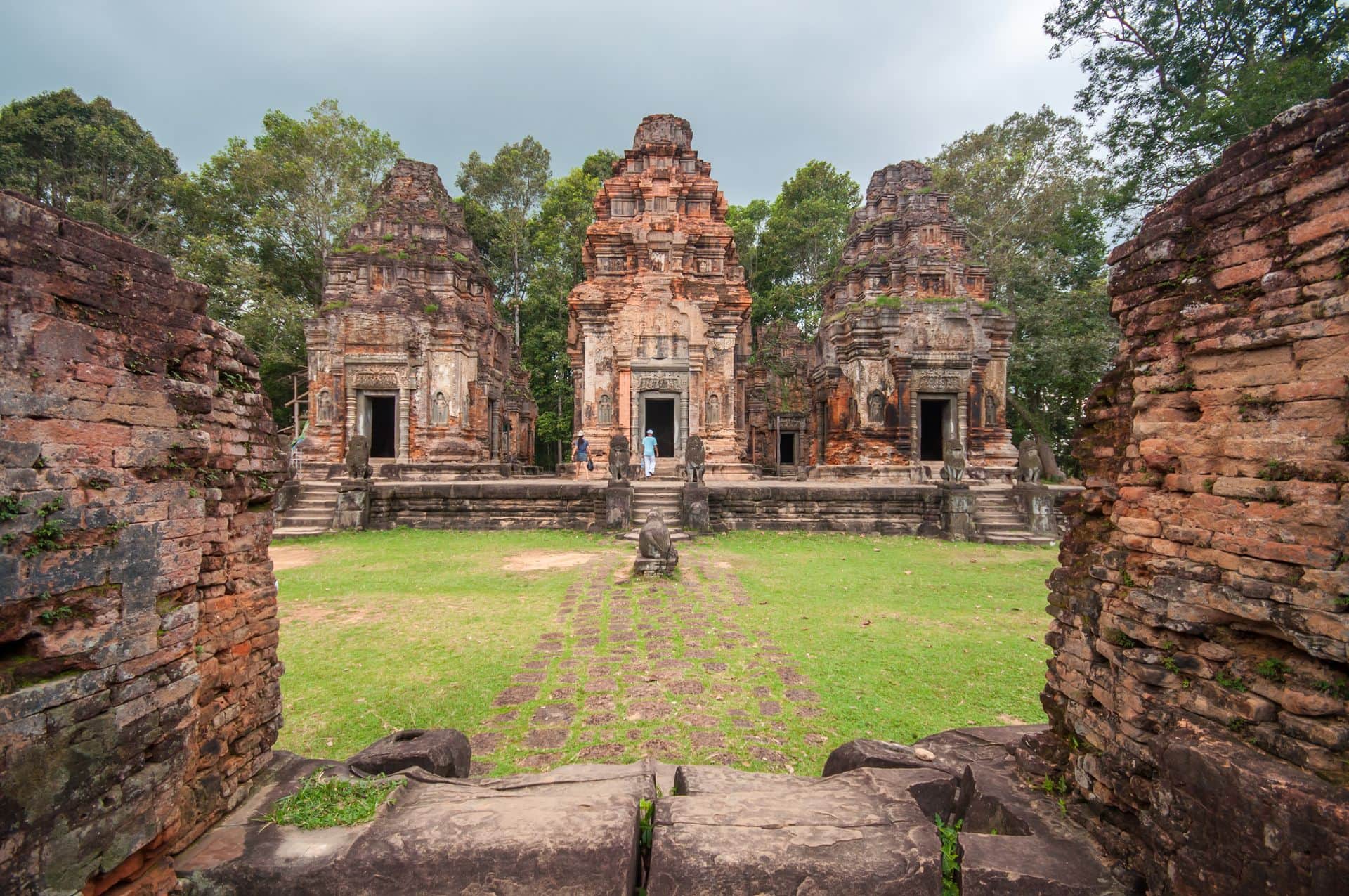 Siem Reap,Cambodia - October 04,2009 : Tourists visiting the ruins of Preah ko temple in Siem Reap, Cambodia.Preah ko was built under the Khmer King Indravarman I in 879 .