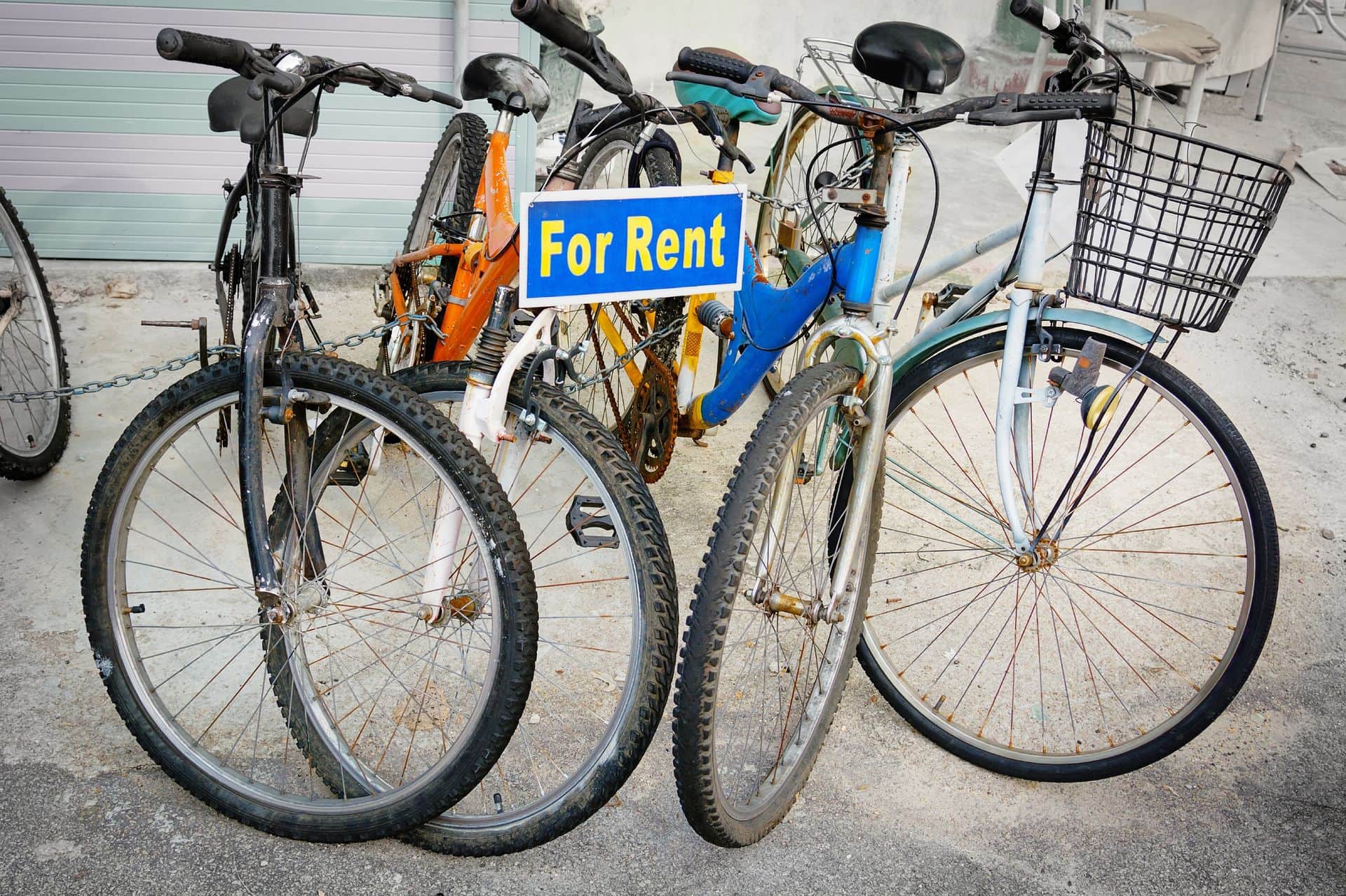 Collection of rental bicycles, chained together on display for tourists.Collection of rental bicycles, chained together on display for tourists.