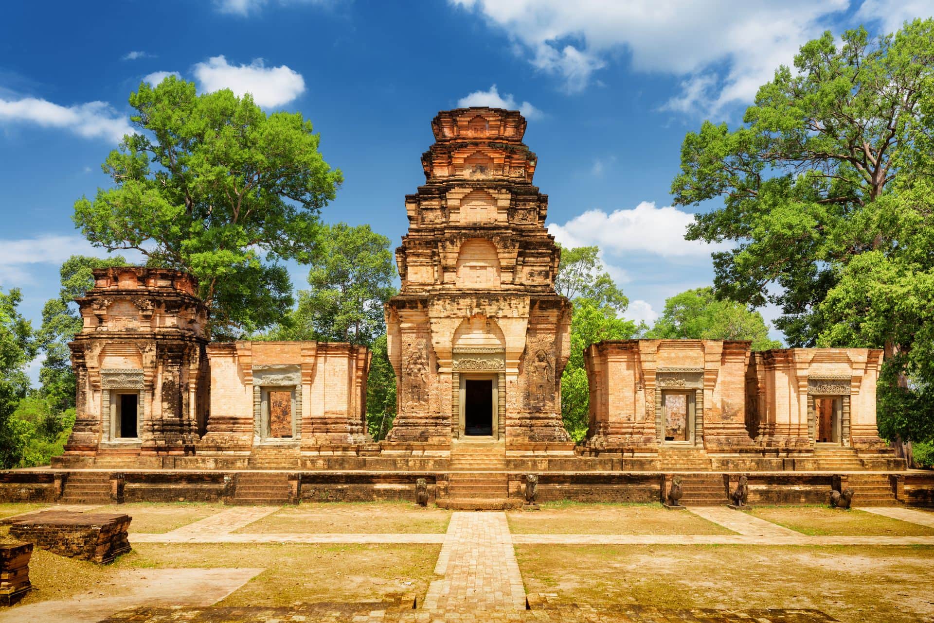 Prasat Kravan temple is Khmer monument in ancient temple complex Angkor Wat on sunny day in Siem Reap, Cambodia. Woods and blue sky in background. Angkor Wat is a popular tourist attraction.