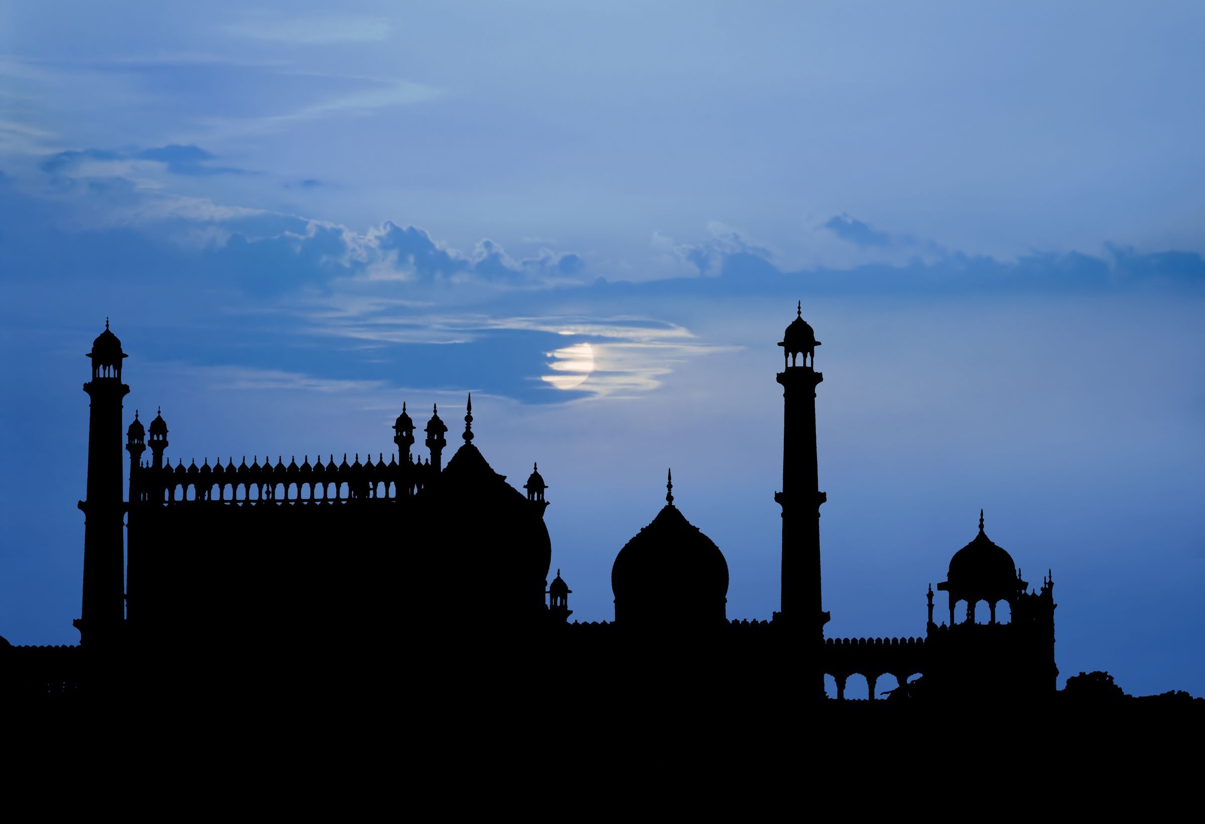 Silhouette of Delhi mosque in the moonlight