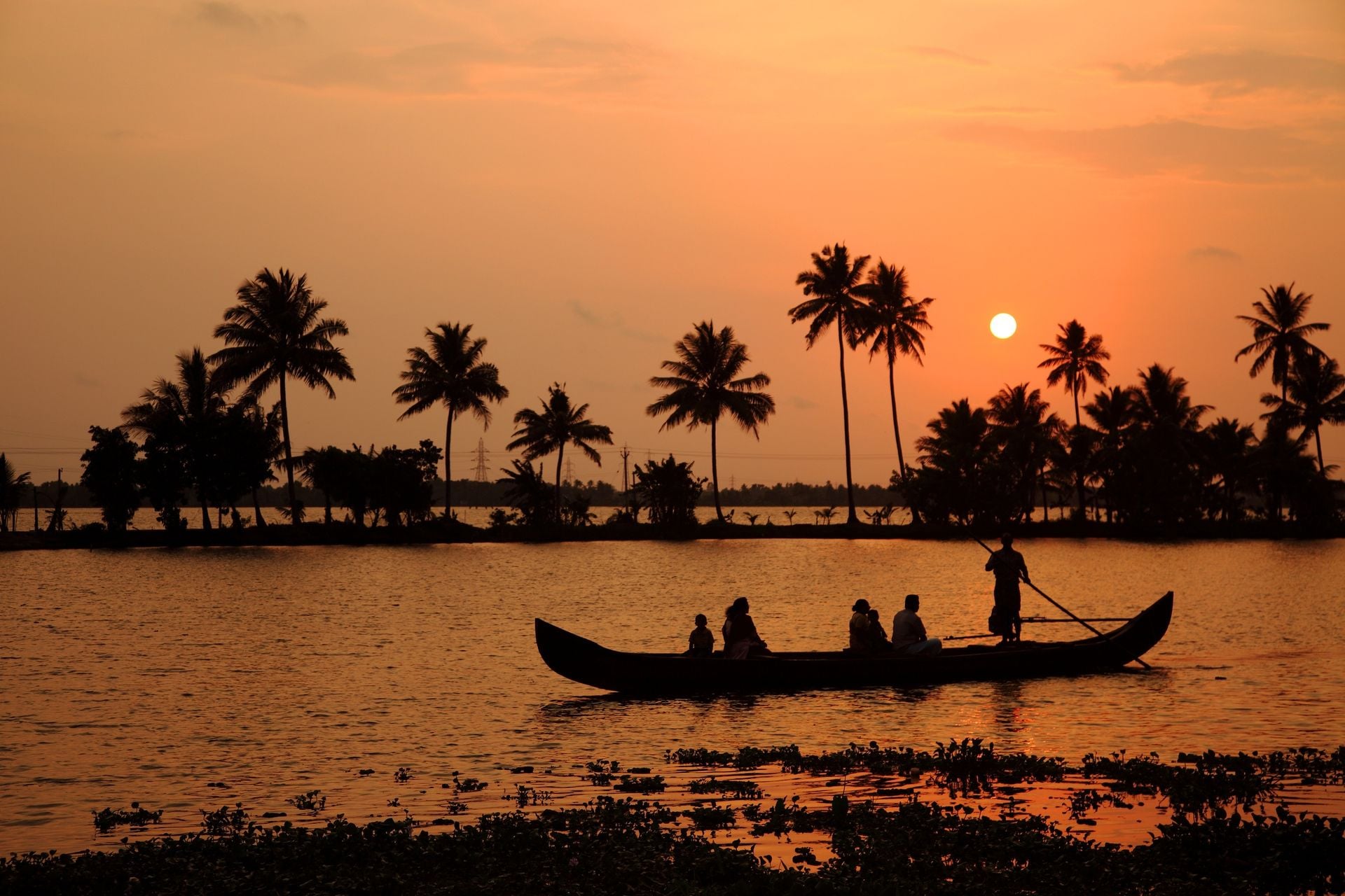Silhouette scene of a ferryboat from the backwaters of Kerala, India.