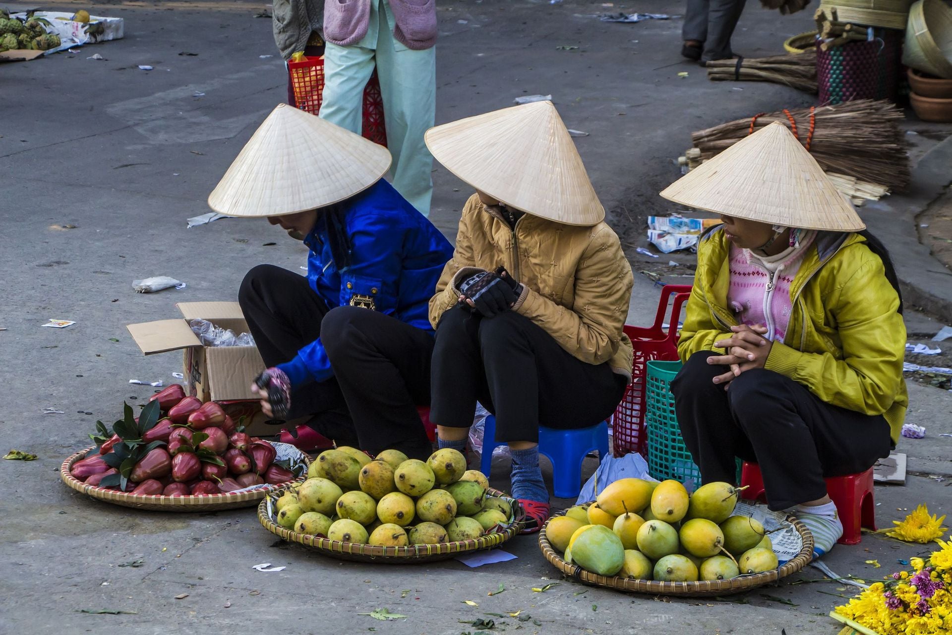 Vietnamese vendors selling fruit and vegetables at Dalat city market, Vietnam