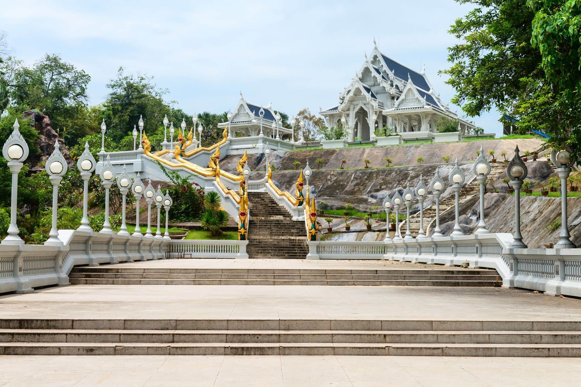 White buddhist temple Wat Kaew Korawaram (Grovaram) in Krabi town, Thailand with wide staircases