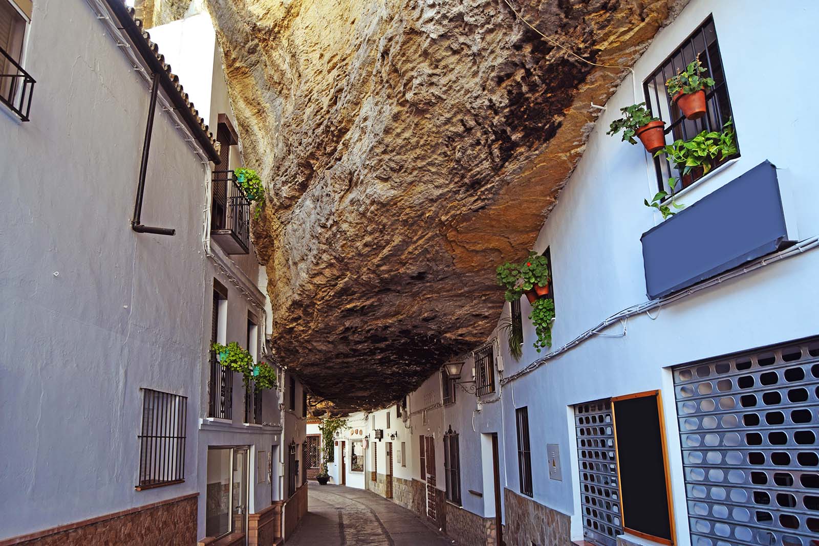 Curious and surprising street of Setenil de las Bodegas, where their houses are under a large giant rock © Shutterstock