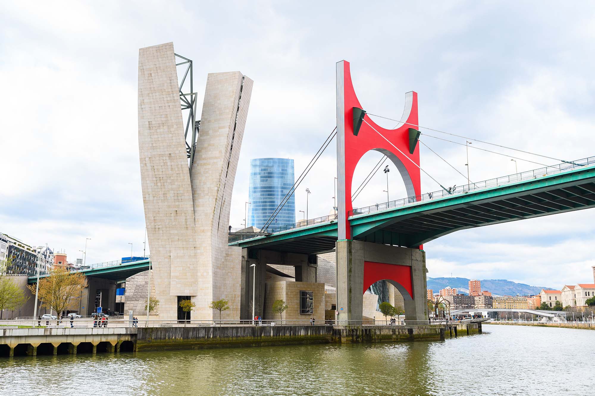modern bridge crossing nervion river at bilbao, spain