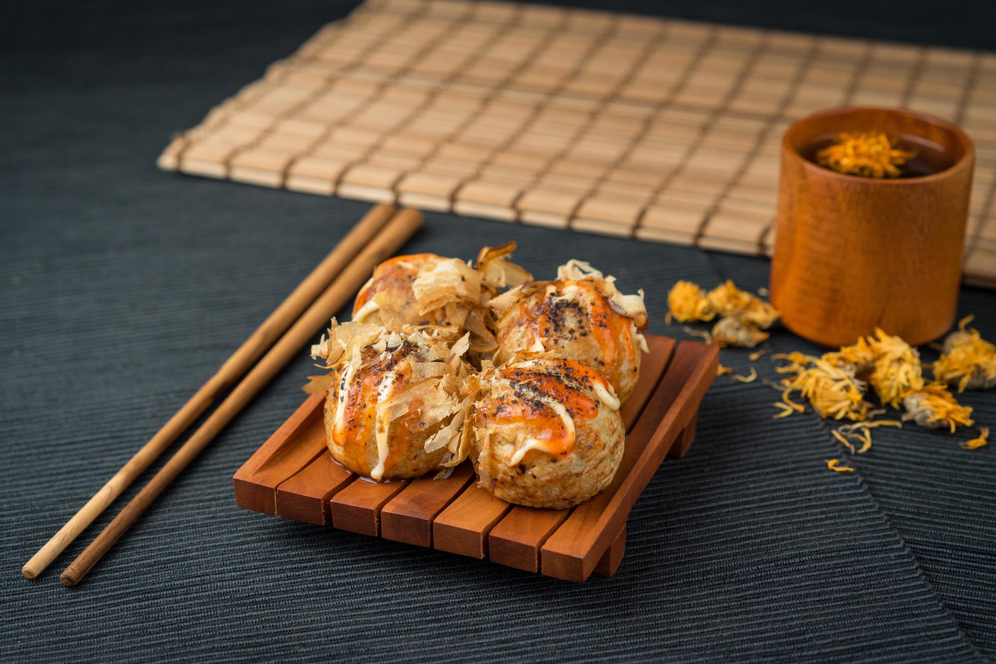 Japanese Street Food Okonomiyaki Takoyaki Dumpling Tako Balls. Photo: Riddick Evander/Shutterstock