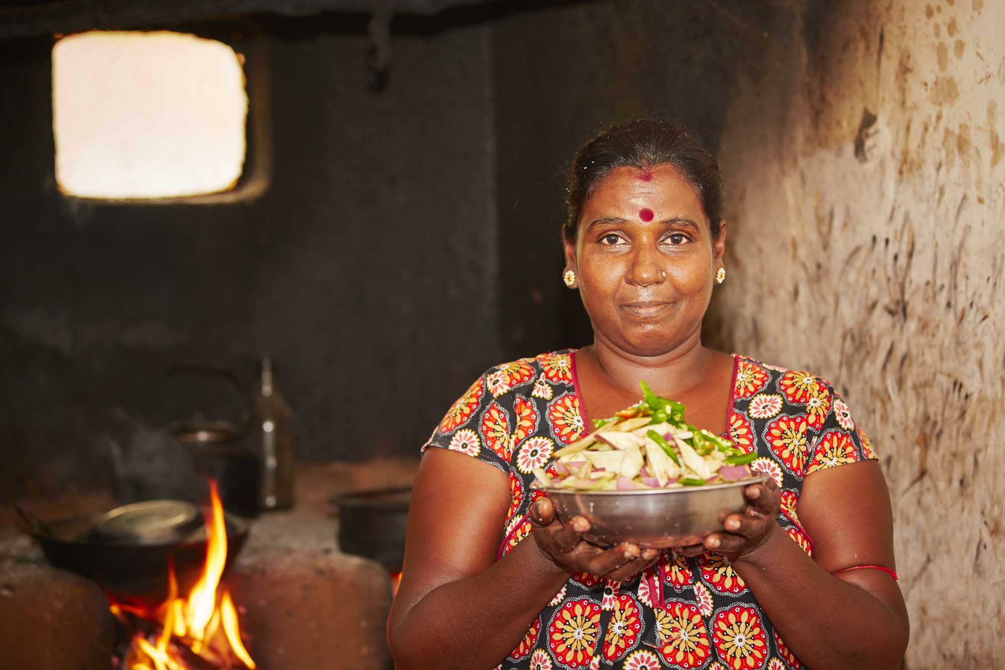 Woman is preparation food in ancient kitchen
