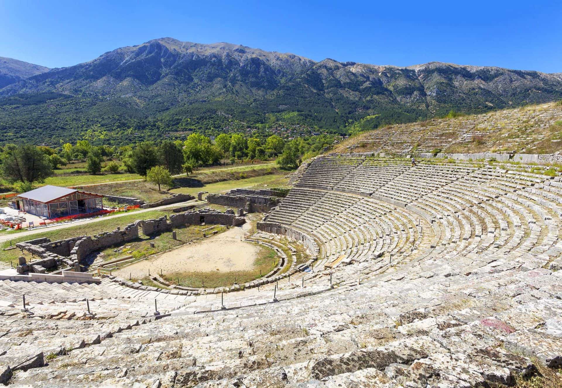 Theater of Dodona with Mount Tomaros in the background, Ioannina, Greece  dodonaepirusioanninatheaterancientantiquearcheologyarchitecturebuildingclassicaleuropegreecehellenicheritagehistorichistorymarblemountoldpastruinstomarosShow more