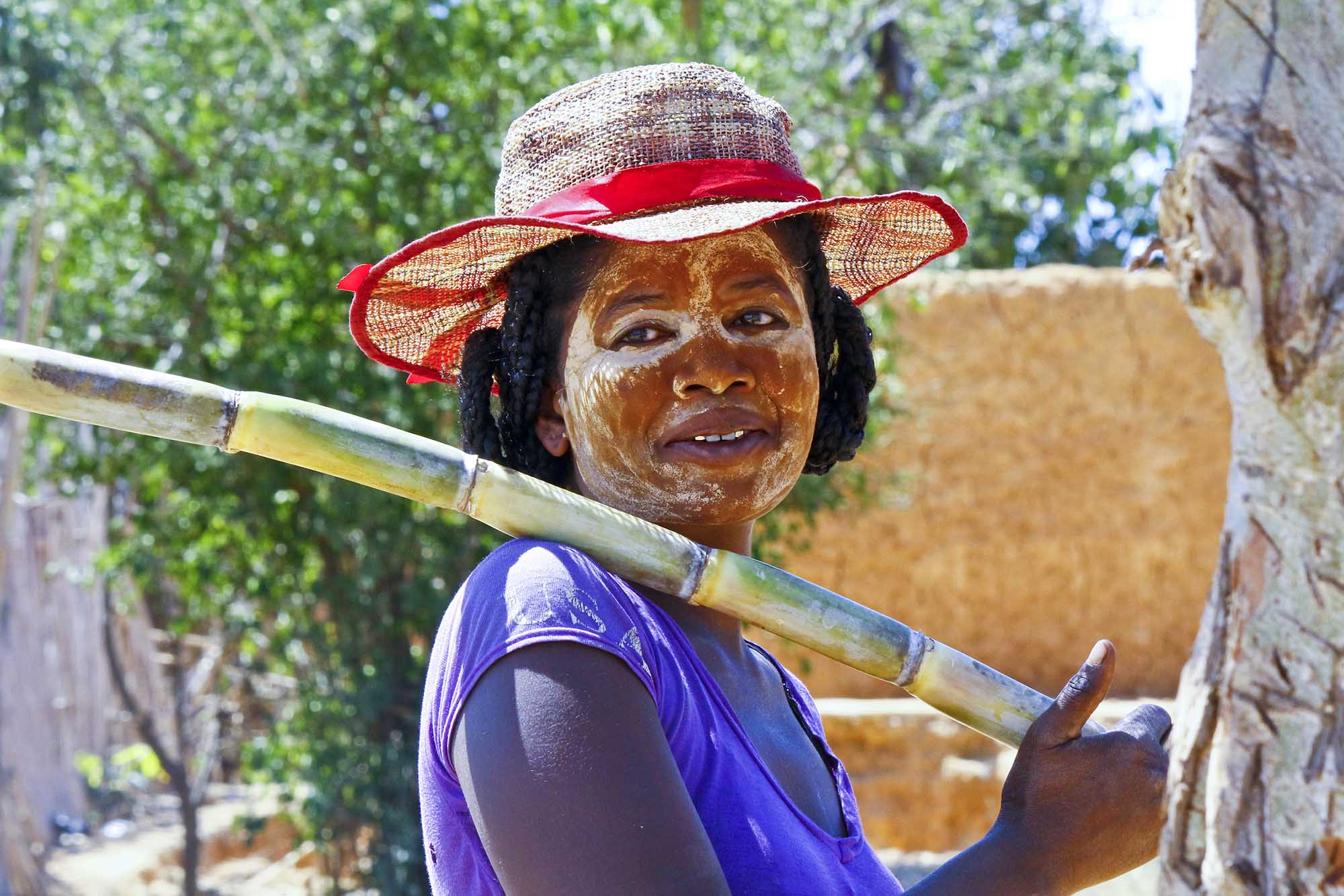 Portrait of malagasy woman with tradytional mask on the face, Madagascar