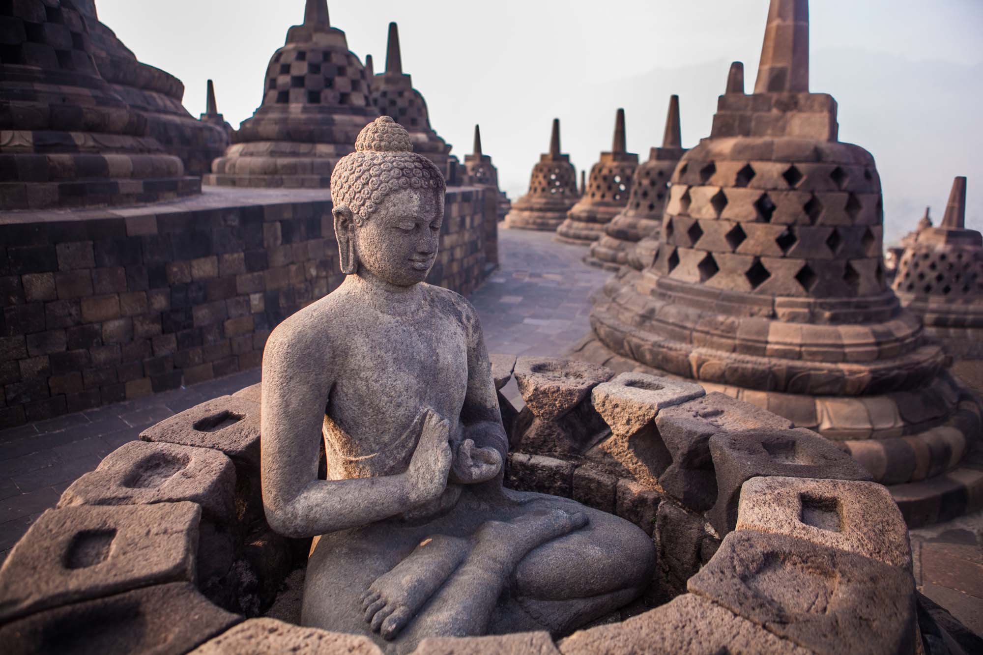 Buddha statue in Buddist temple of Borobudur in the morning.