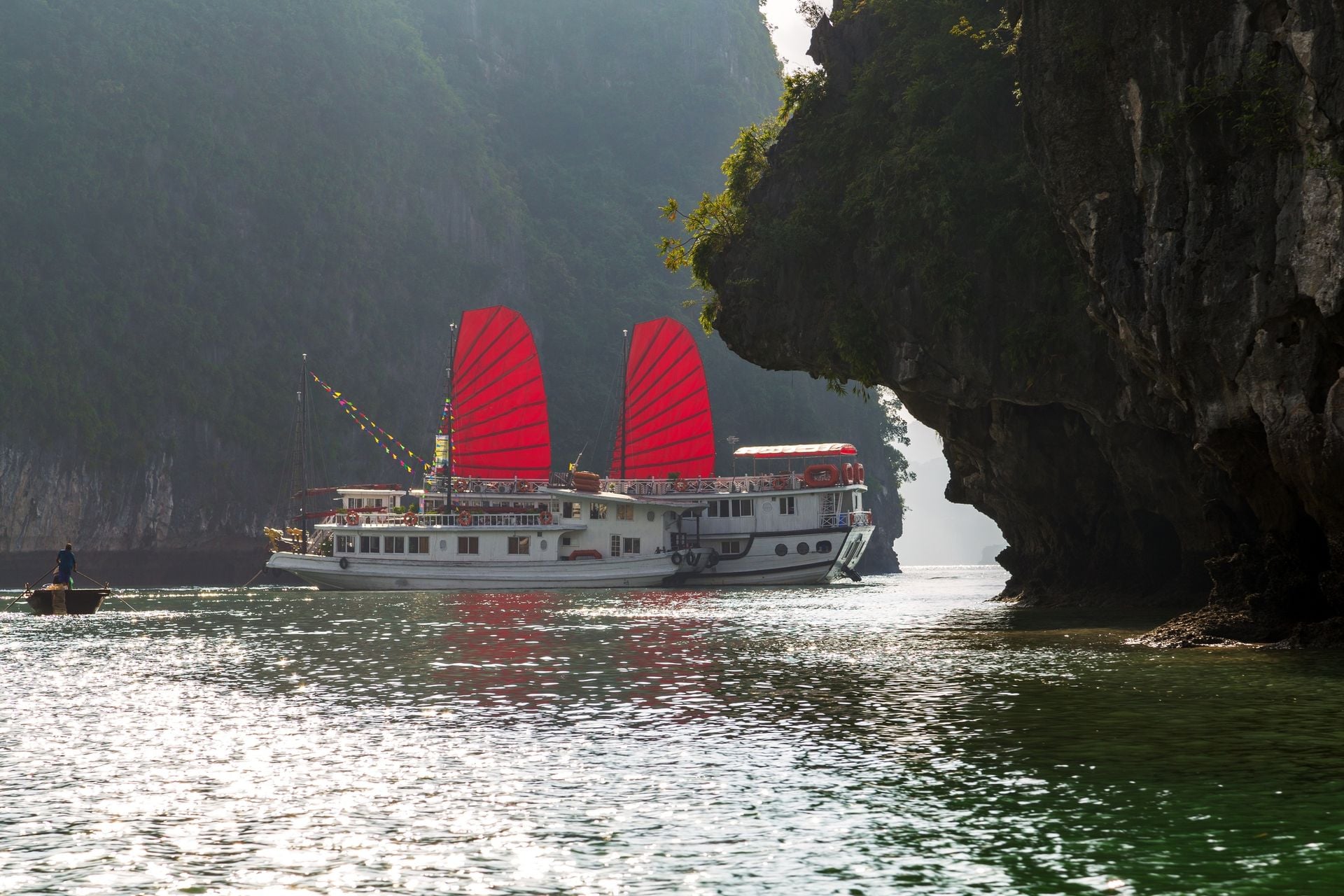 Ha Long Bay Vietnam traditional boat red sail.