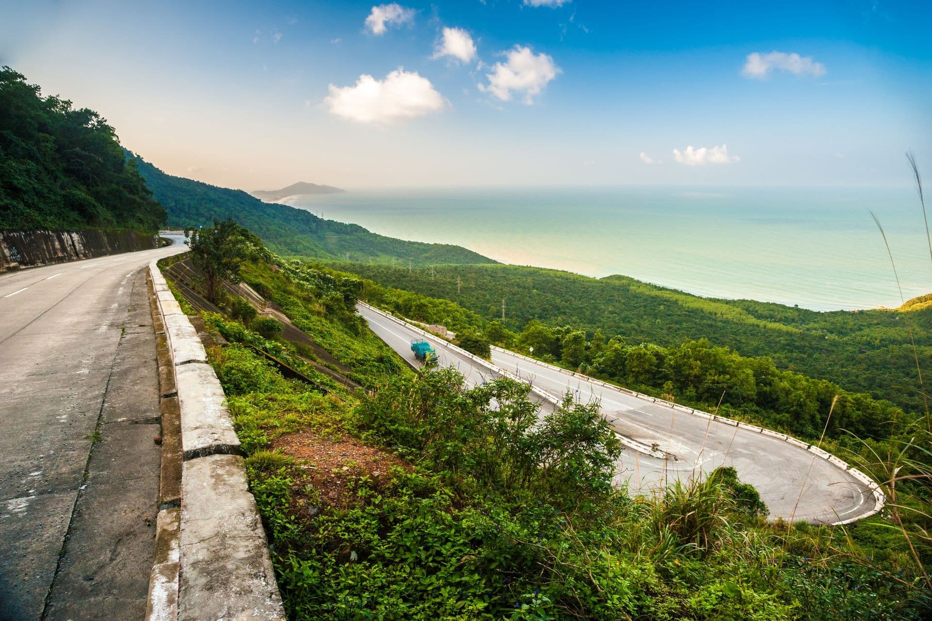 Hai Van pass - the famous road which leads along the coastline mountains near Da Nang city, Vietnam. Beautiful nature and transportation background.