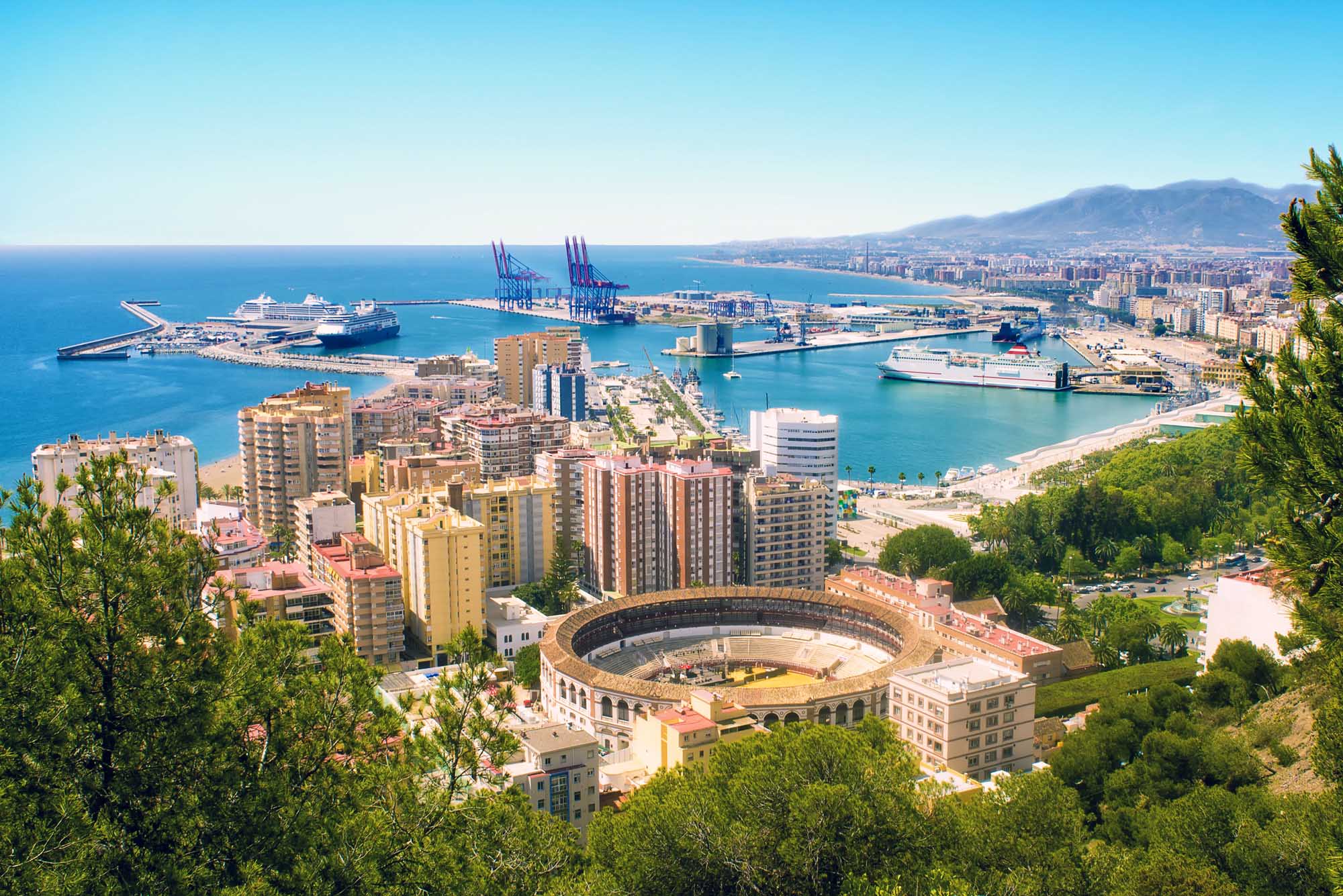 View of Malaga with bullring and harbor