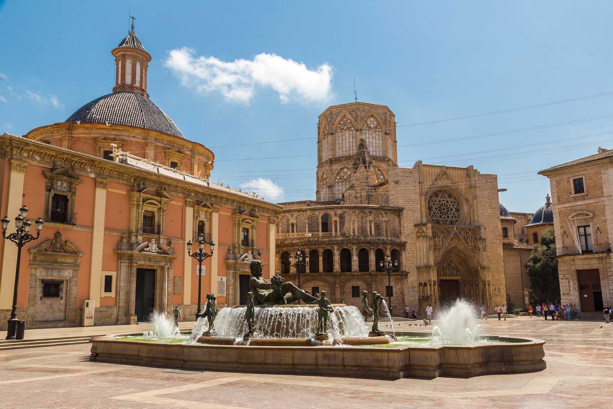 Square of Saint Mary's and fountain Rio Turia in Valencia in a summer day, Spain