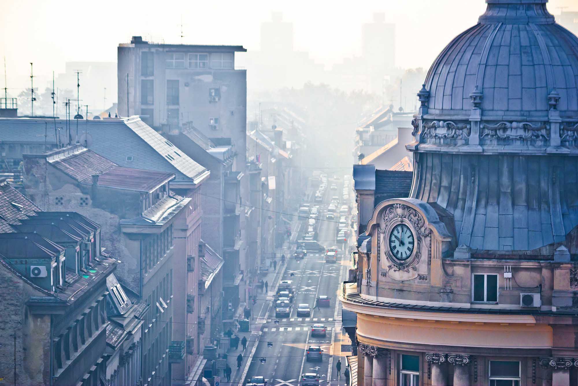 Busy Zagreb street in morning haze with old architecture aerial view, capital of Croatia