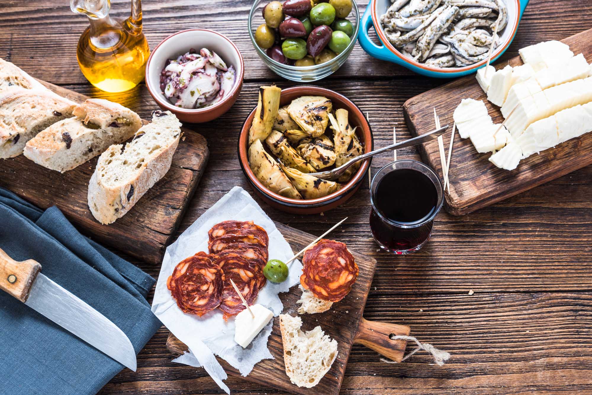 Sharing authentic spanish tapas with friends in restaurant