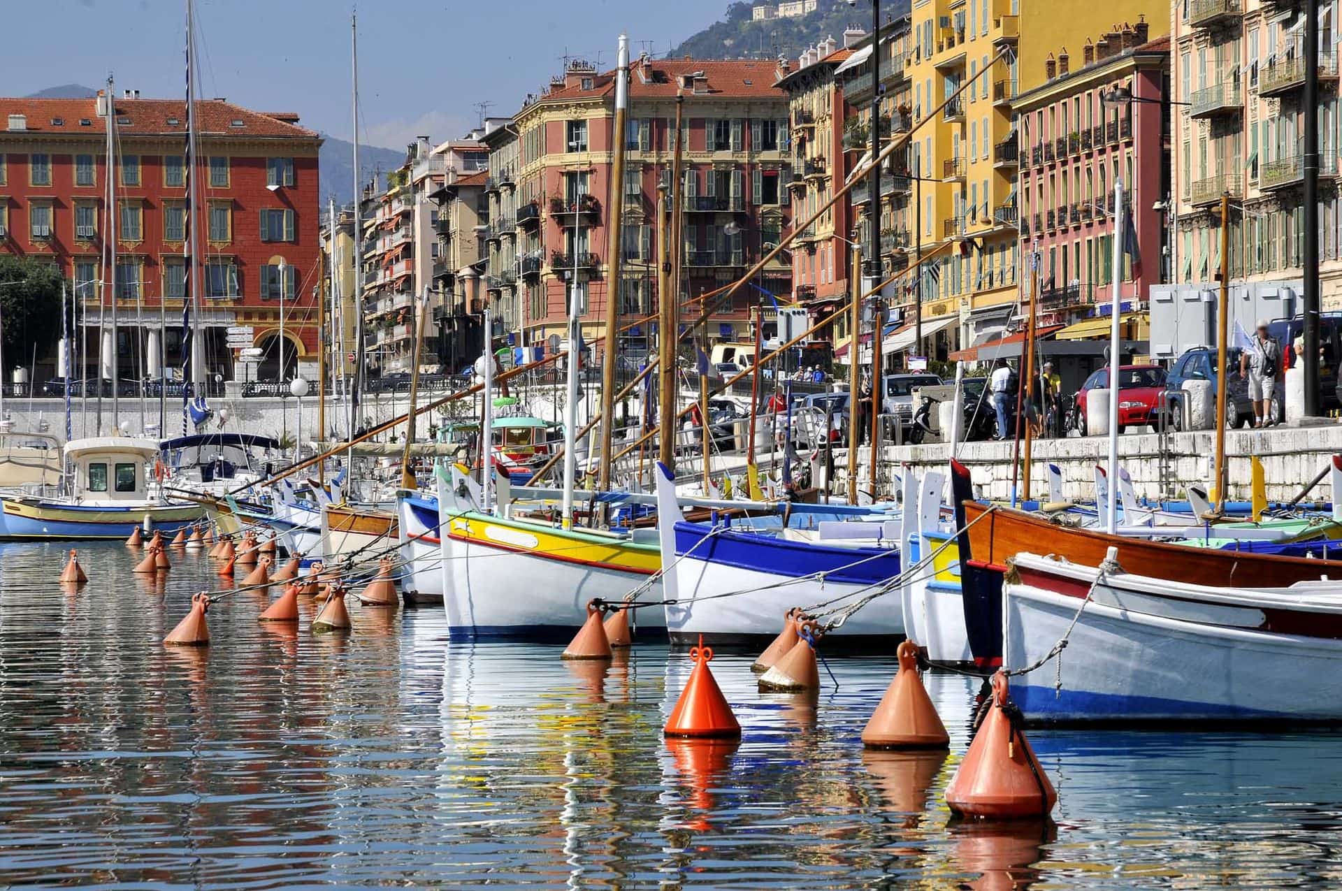 Boats in the port of Nice in southeastern France,department Alpes-maritimes, with colorful buildings in the background