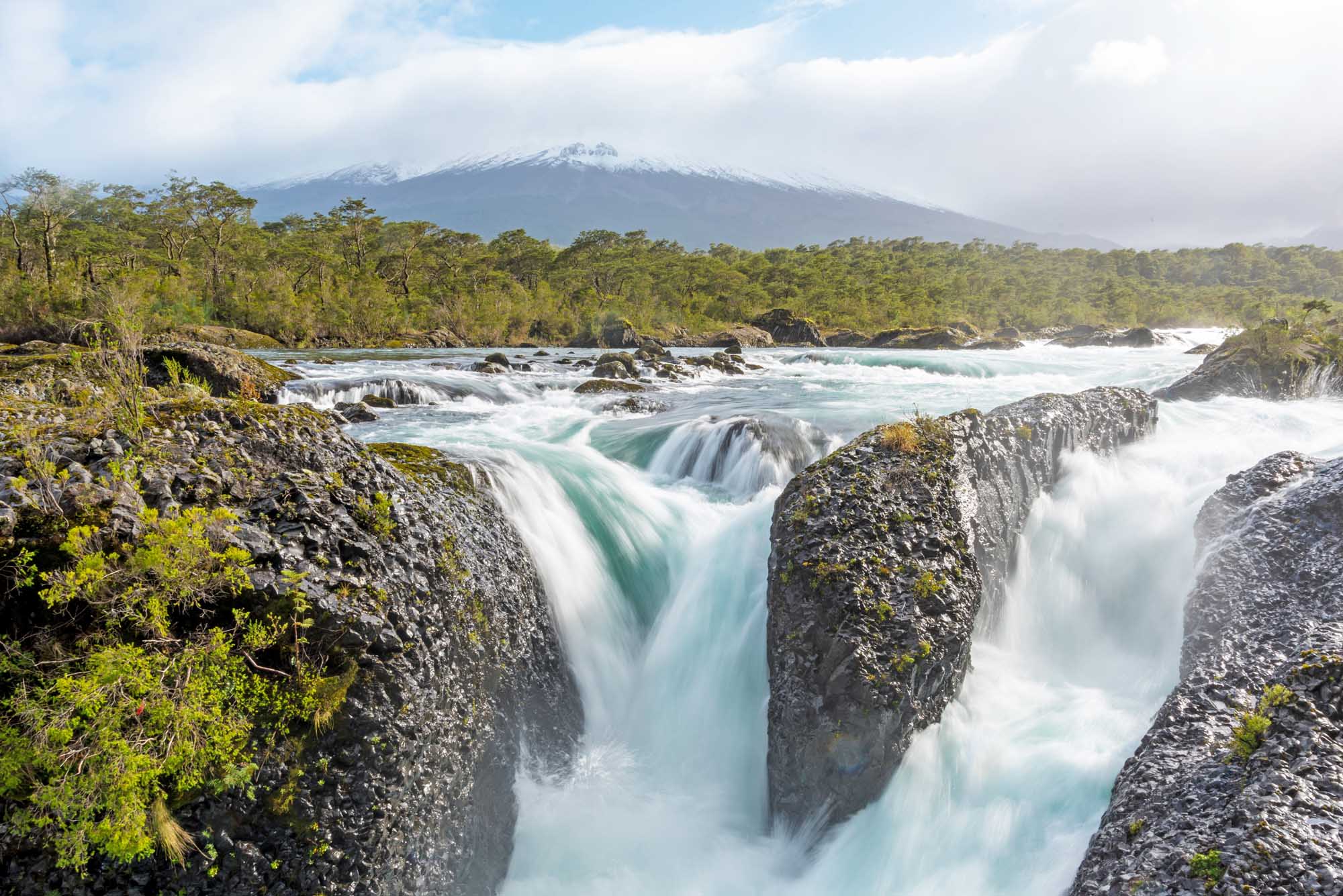 Petrohue Falls and Osorno Volcano with its snowy peak near Puerto Varas, Chile