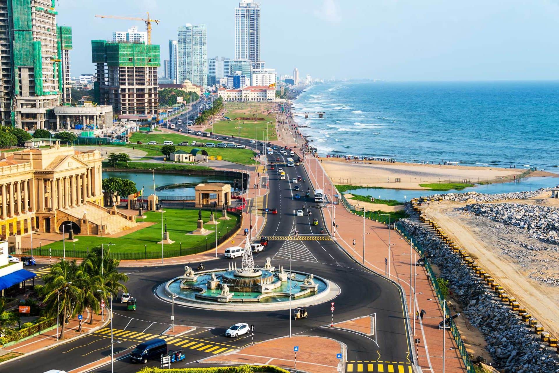Aerial view of Colombo, Sri Lanka with modern buildings and a coastal promenade area.