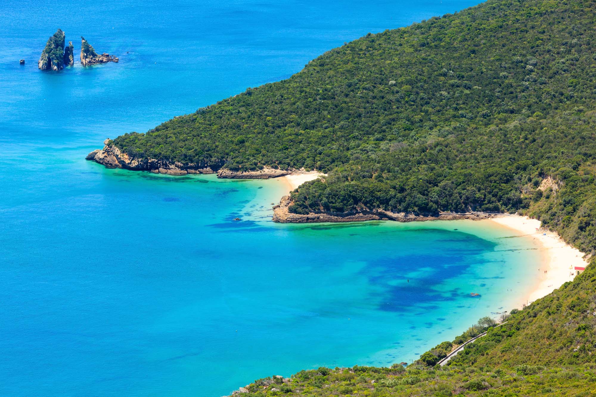 Summer sea coastal landscape (with sandy beach) of Nature Park Arrabida in Setubal, Portugal.