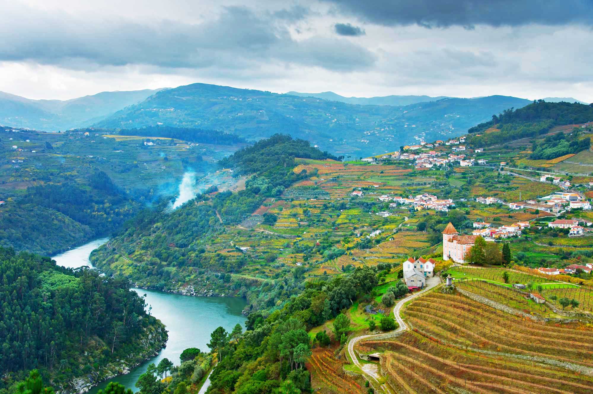 View of Douro river, wineyards and villages on a hills. Portugal