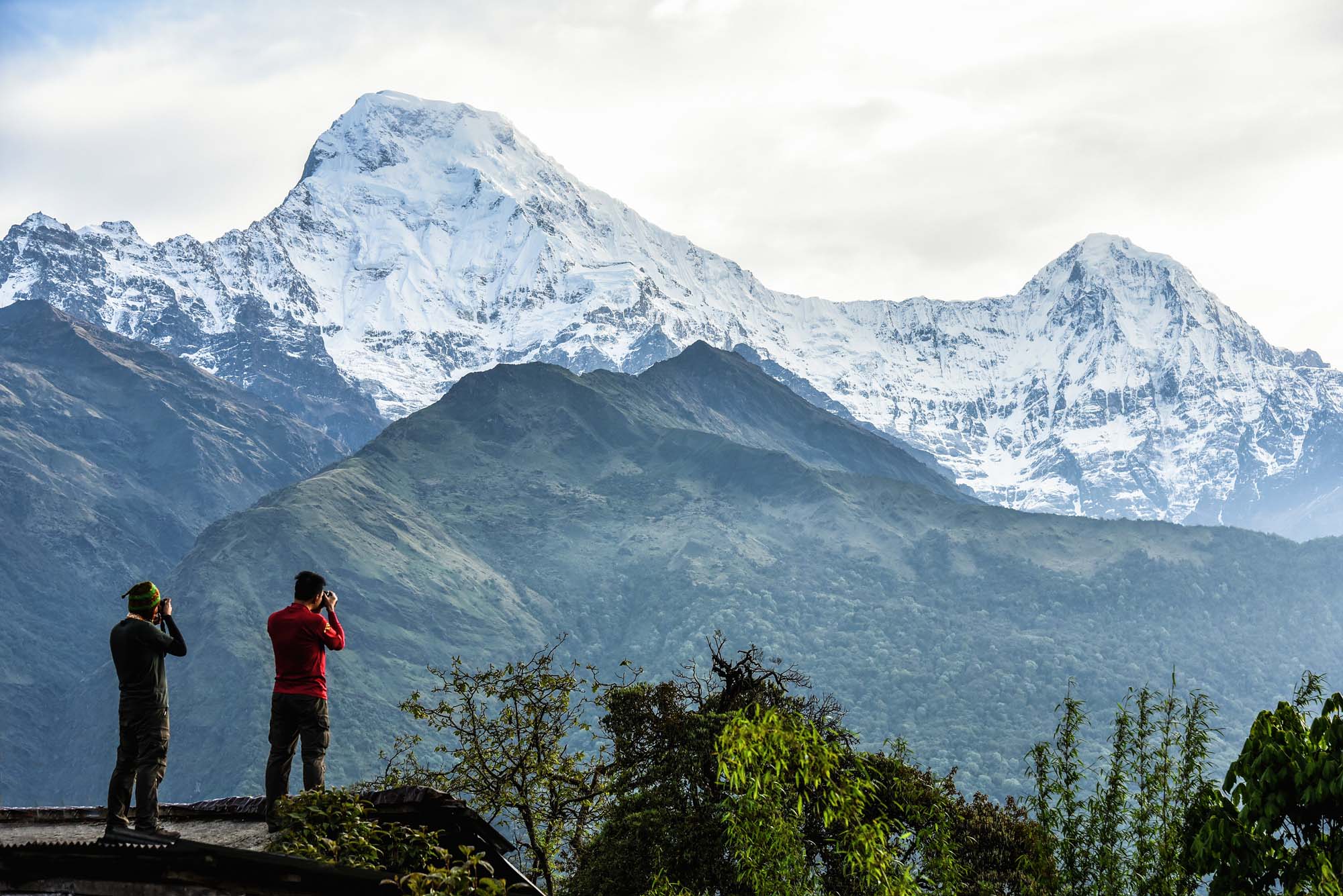Tourists are taking pictures view of Mount Annapurna from Tadapani village