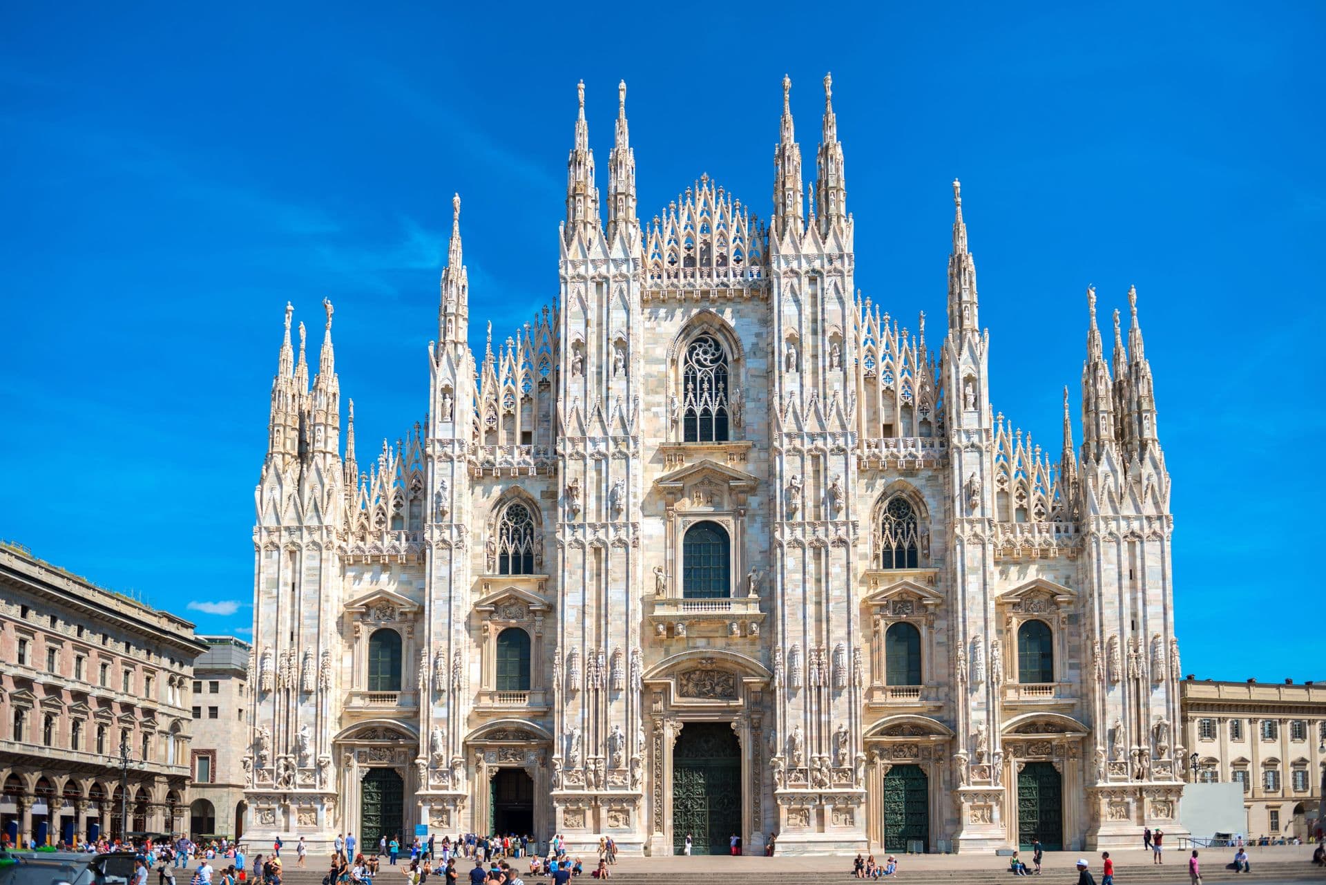 Daytime view of famous Milan Cathedral (Duomo di Milano) on piazza in Milan, Italy