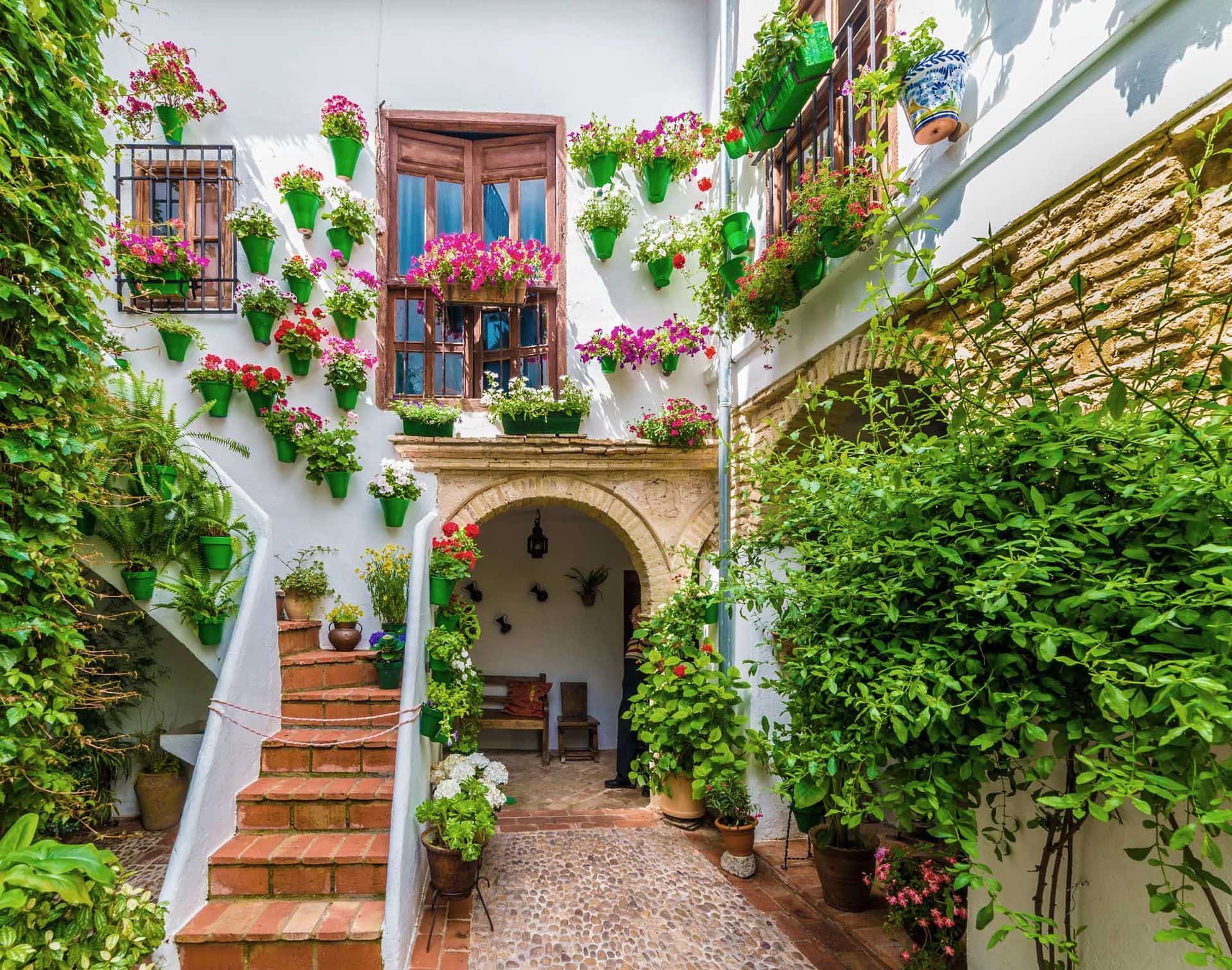 Traditional house and courts with flower in Cordoba, Spain
