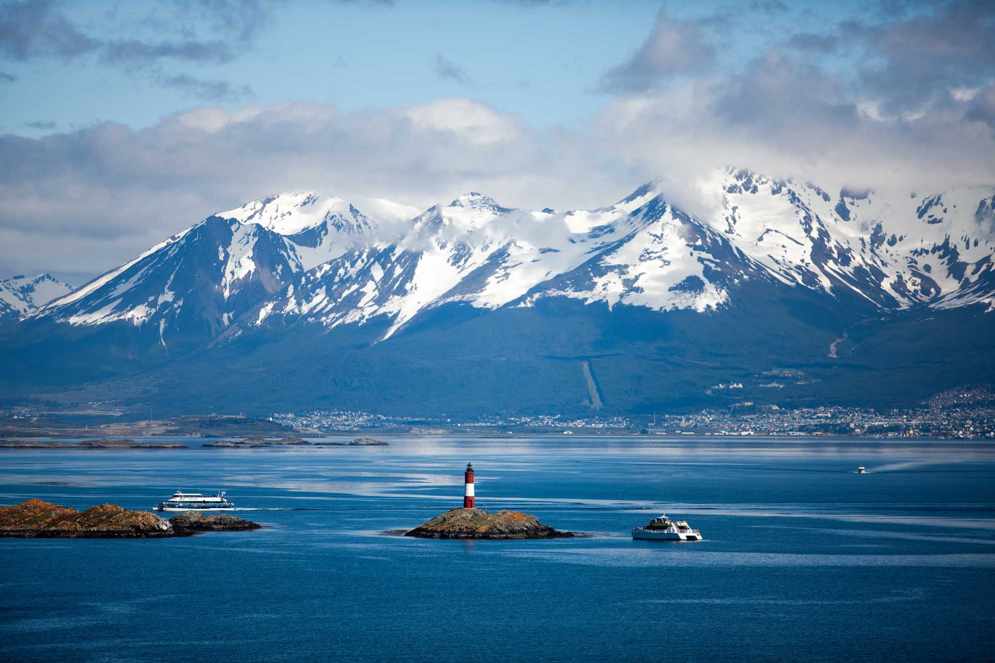Tierra del Fuego, landscape of snowy and wooded mountains and ocean