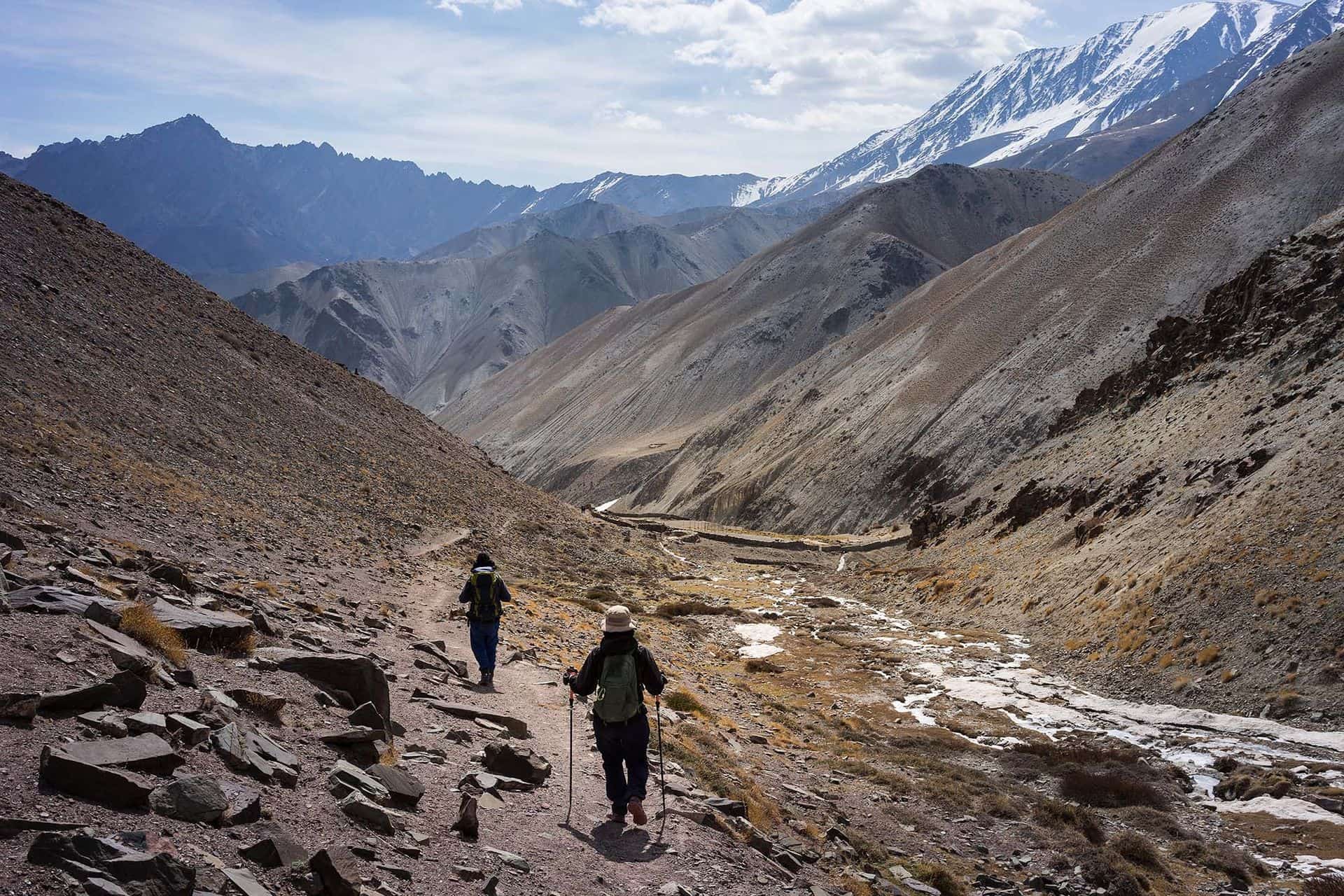 A man and a woman trekking on Markha valley trekking route - Leh Ladakh - India