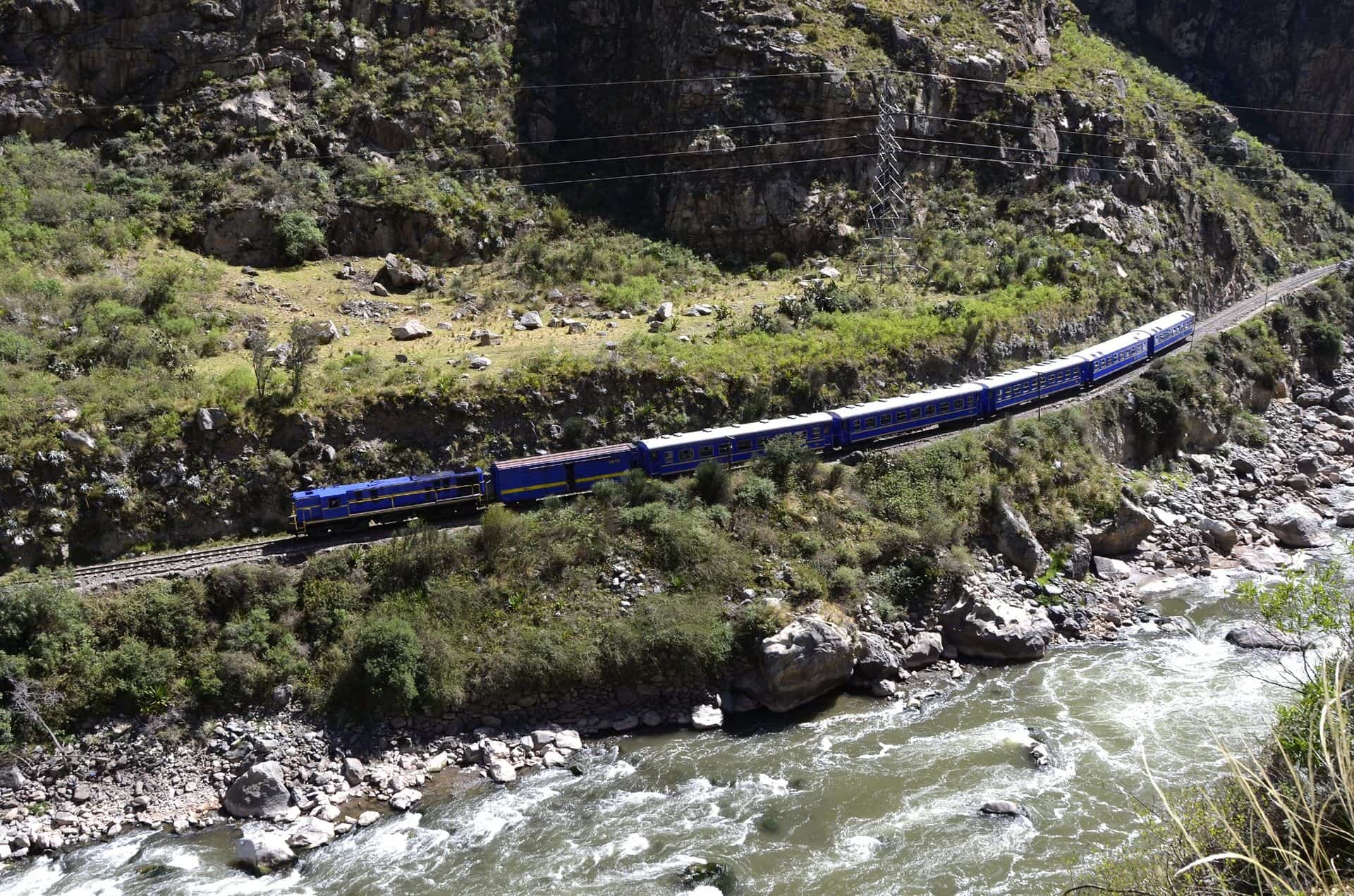 Train going to Machu Picchu from Cuzco in the valley with Urubamba river