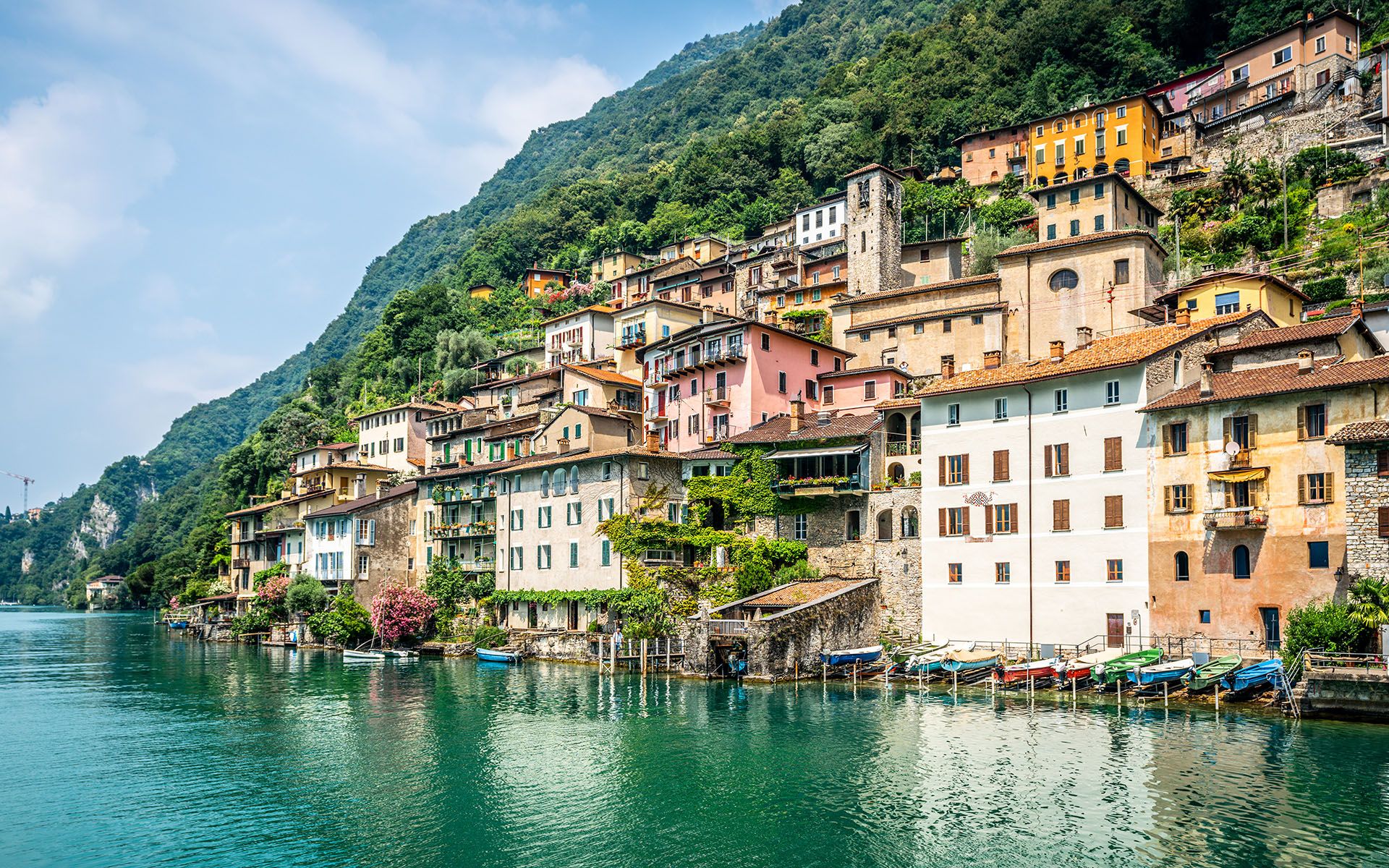 View of Gandria fishermen village with colorful houses on Lake Lugano lakeside on beautiful summer day in Ticino Switzerland © Keitma/Shutterstock