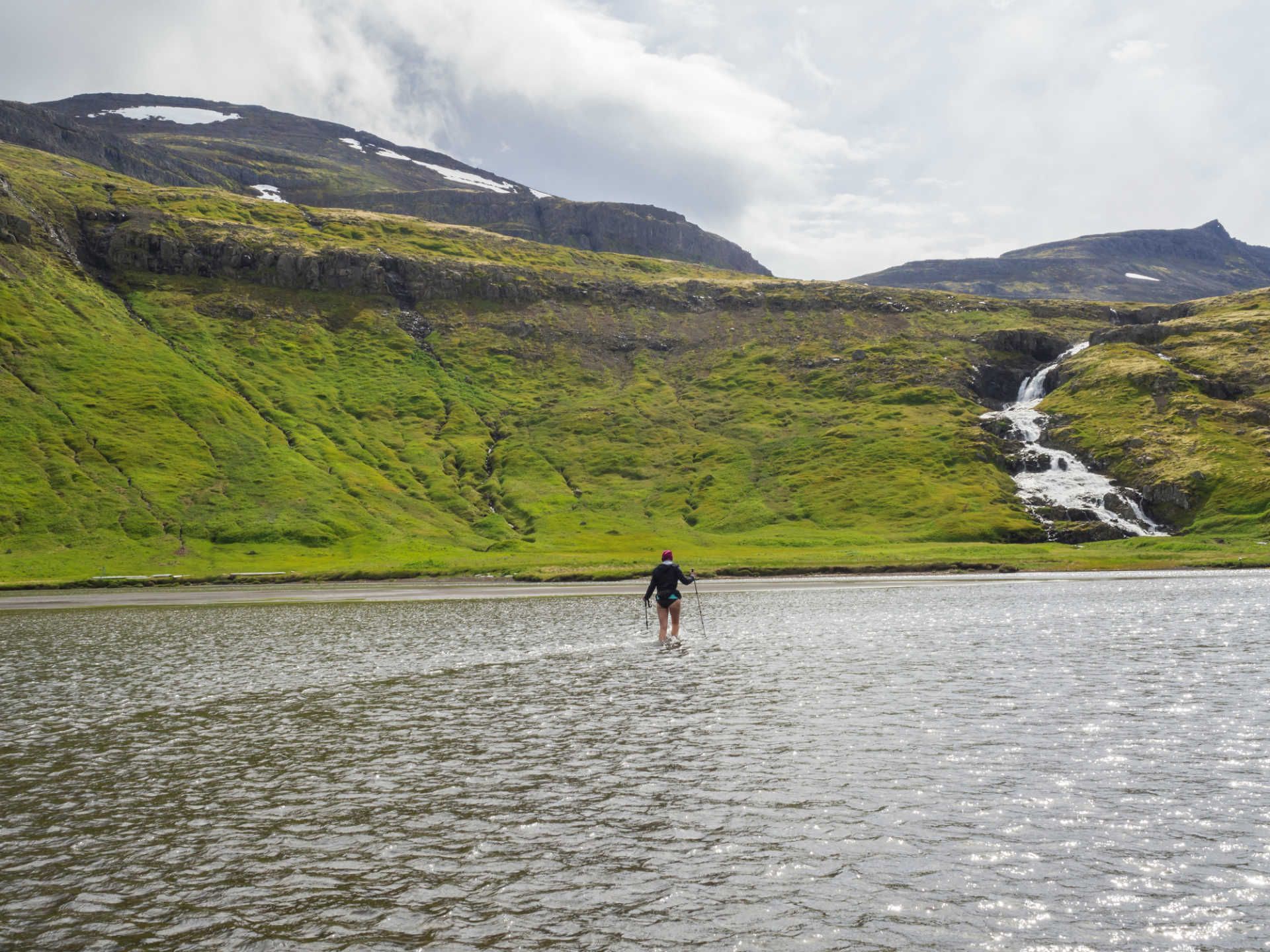 waterfall-greeen-hills-trekking- hornstrandir-iceland-shutterstock_1174584331