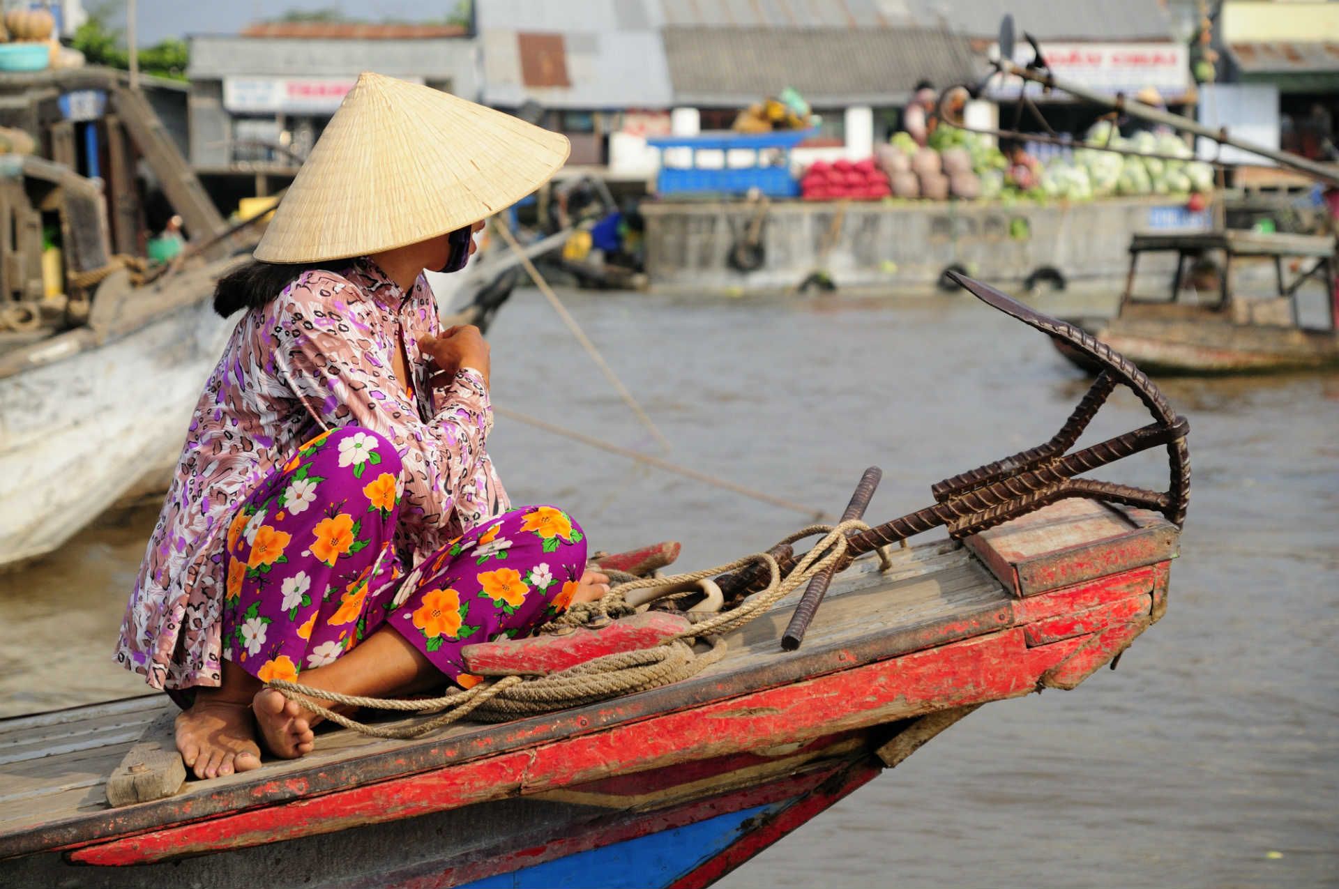 woman-float-market-mekong-delta-vietnam-shutterstock_90906923